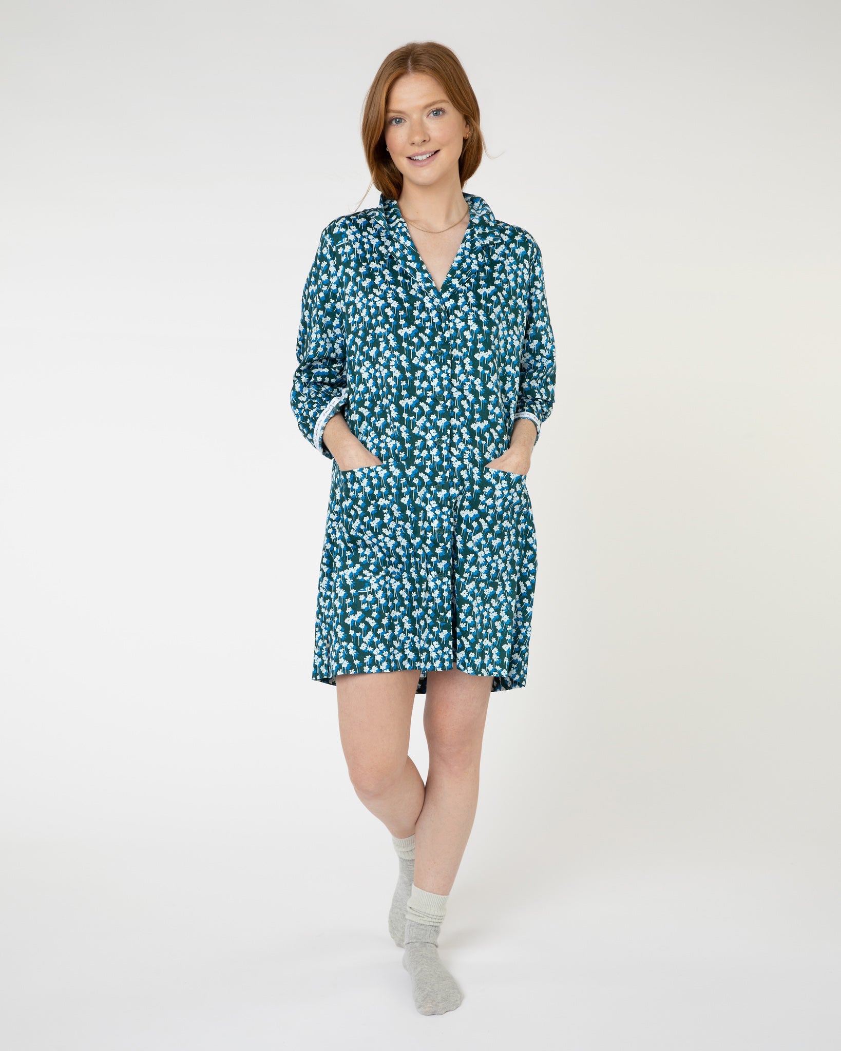 Woman wearing green floral luxury organic cotton nightshirt from Yawn.