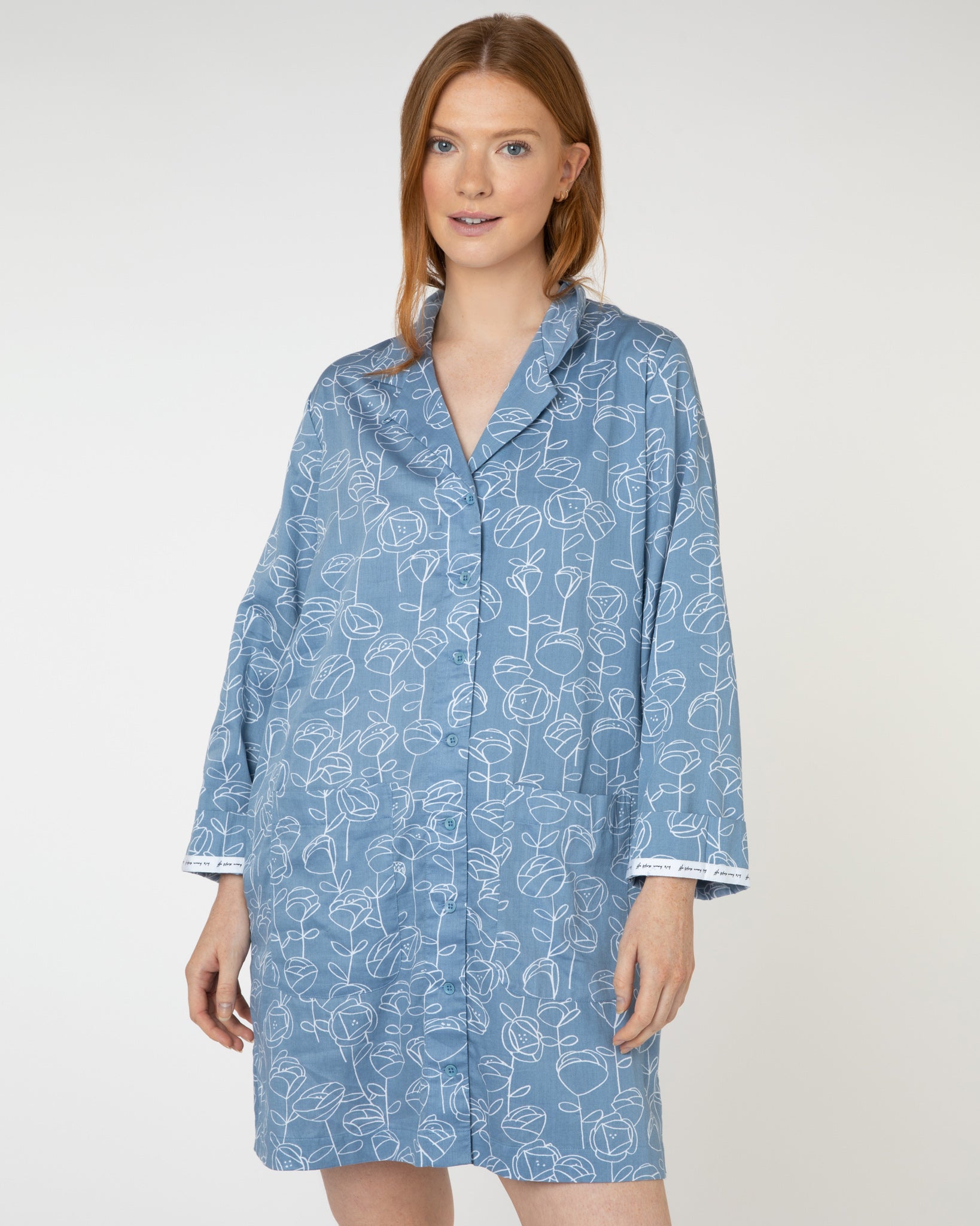 Woman wearing blue and white floral luxury organic cotton nightshirt from Yawn.